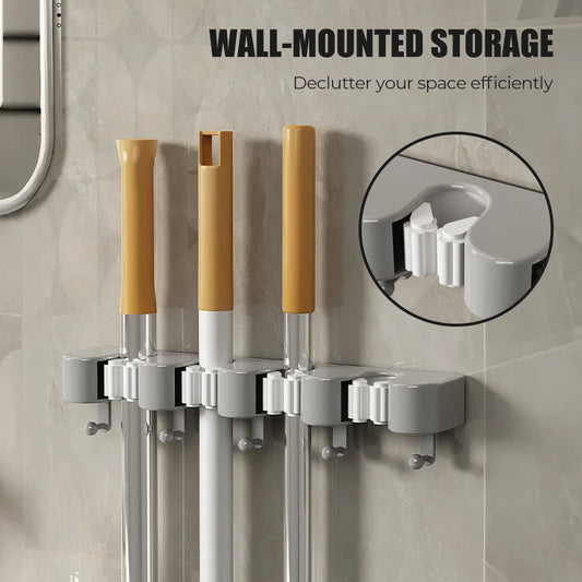 Seinälle kiinnitettävä mopin ja luudan pidike